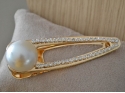 Rhinestone hair clip and large white pearl